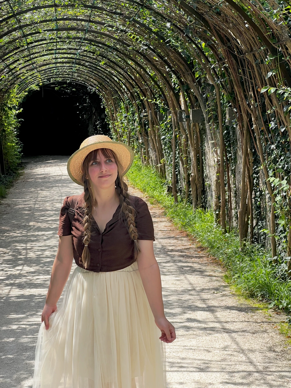 Bruna Carvalho in a tunnel archway